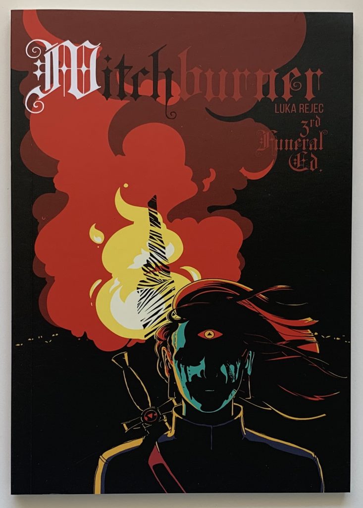 Gamebook. Witchburner by Luka Rejec. Shows a a person carrying a sword. Their face is shadow. A bonfire behind them obscures the silhouette of a person tied to a stake within the inferno.